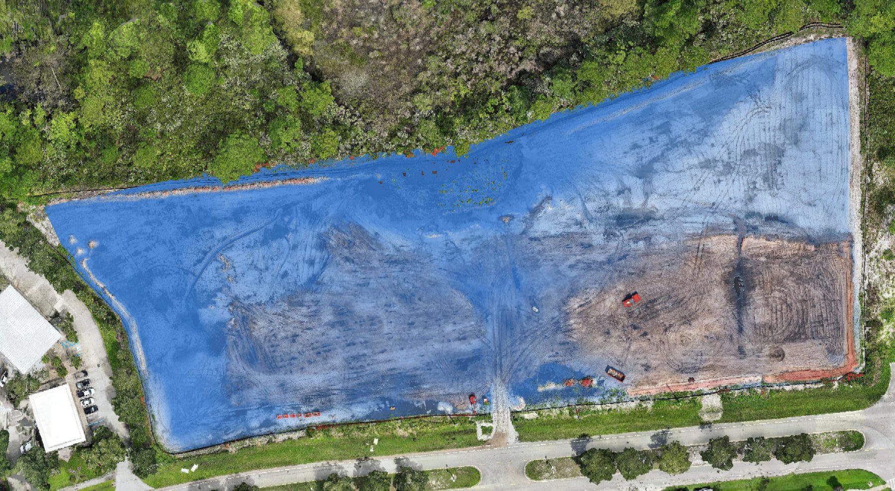 Fill-to-design map over the drone orthomosaic of a Florida commercial development